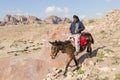 Petra, Jordan Ã¢â¬â December 24th, 2015: Bedouin man riding a horse